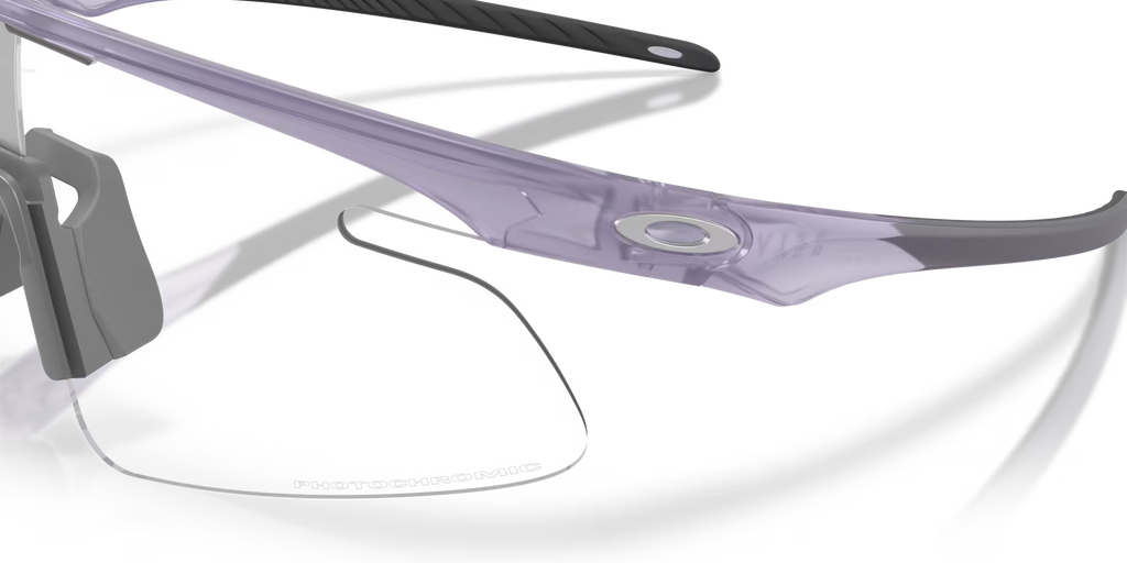 Oakley RSLV Lite Sunglasses – Clear to Black Iridium Photochromic Lens with Matte Transparent Lilac Frame