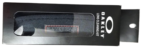 Oakley lens cleaning kit packaging with microfiber cloth and cleaning solution